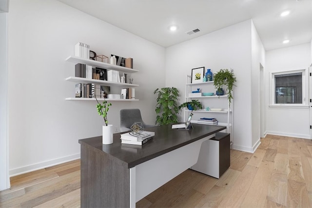 office with light hardwood / wood-style flooring