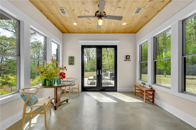 sunroom with wood ceiling, french doors, and ceiling fan