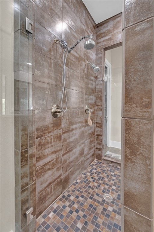 bathroom with tiled shower