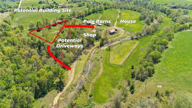 birds eye view of property with a rural view