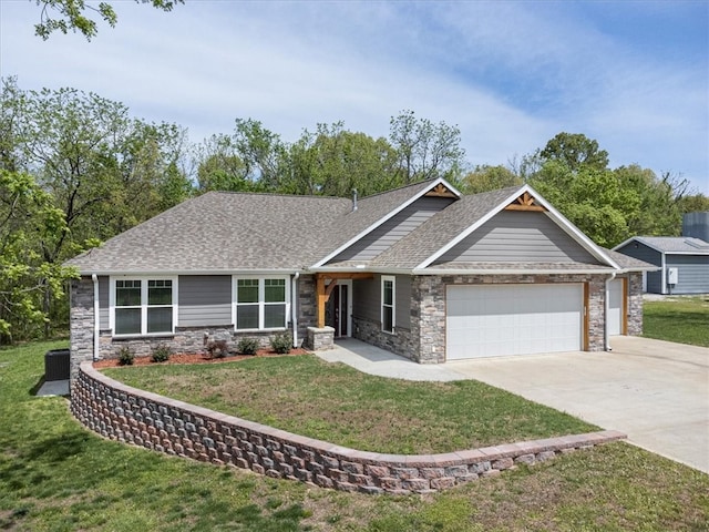 craftsman inspired home featuring a front lawn and a garage