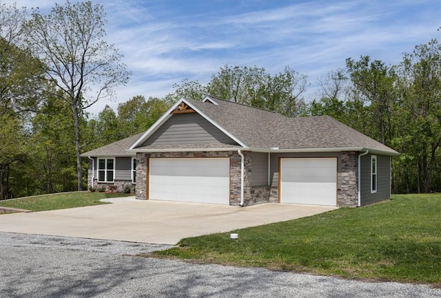 view of front facade with a garage and a front yard