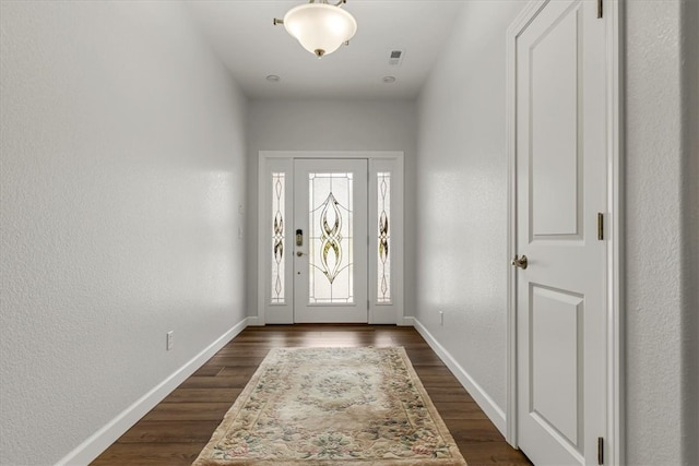 entryway with dark wood-type flooring