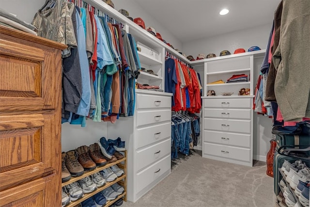 spacious closet featuring carpet floors