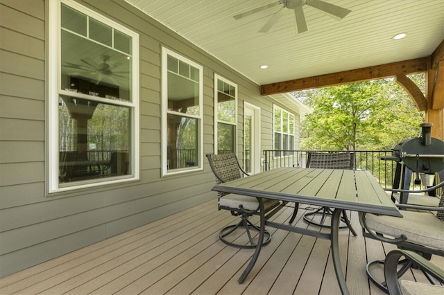 wooden terrace with a grill and ceiling fan