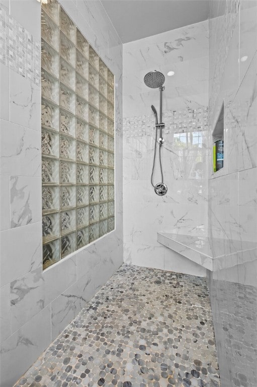 bathroom with tiled shower