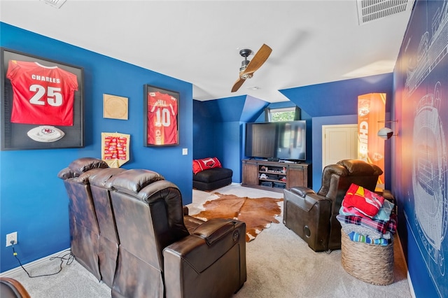 carpeted home theater featuring ceiling fan and lofted ceiling