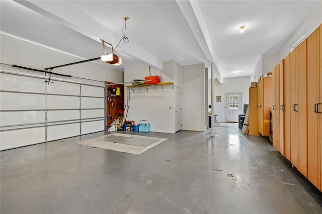 garage featuring a garage door opener