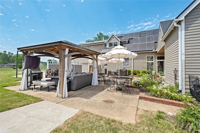 exterior space featuring a gazebo and an outdoor hangout area