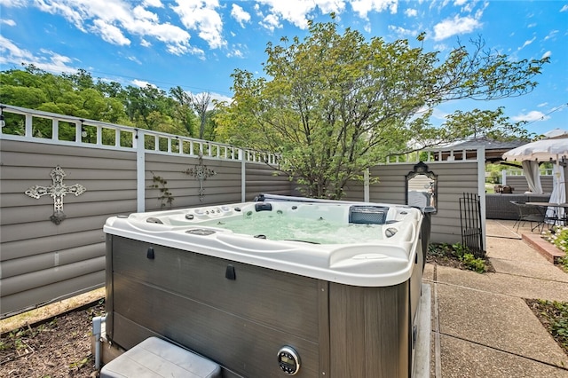 view of patio with a hot tub