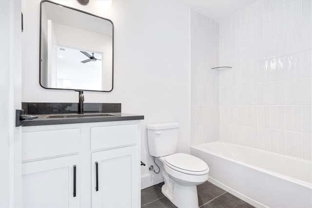 full bathroom featuring tiled shower / bath combo, vanity, tile floors, and toilet