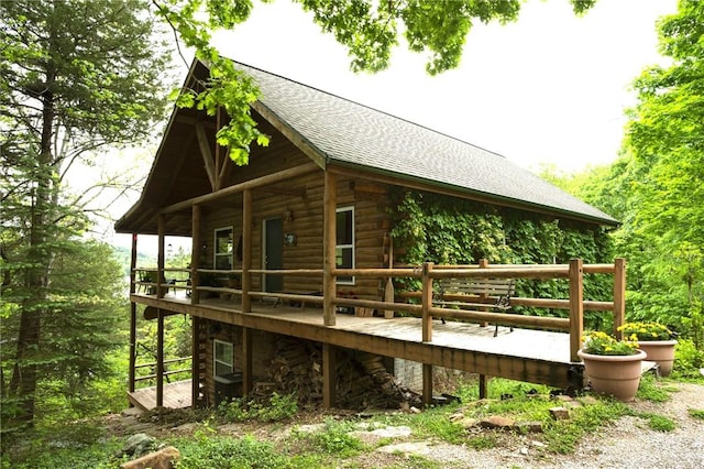 view of side of home with a wooden deck