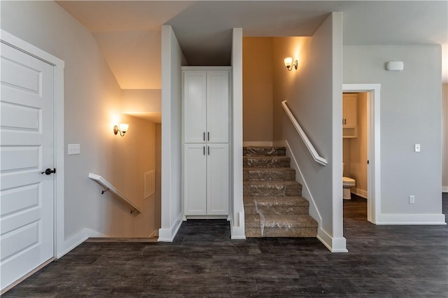 stairs featuring hardwood / wood-style flooring