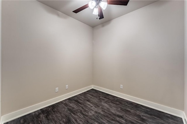 spare room with dark wood-type flooring and ceiling fan