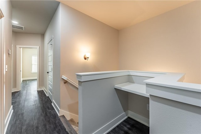 corridor with dark wood-type flooring