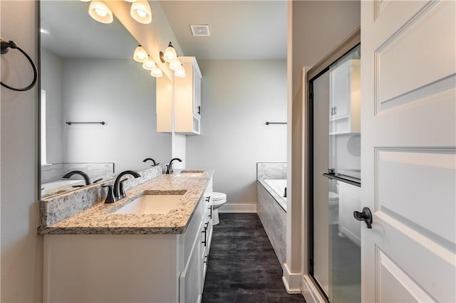 full bathroom featuring wood-type flooring, toilet, vanity, and plus walk in shower