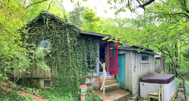 view of shed / structure with a hot tub