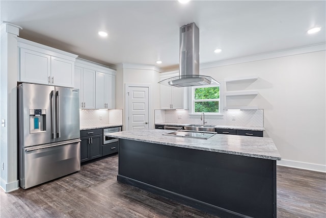 kitchen featuring dark hardwood / wood-style flooring, stainless steel appliances, white cabinetry, and a kitchen island