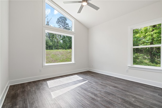 unfurnished room featuring a wealth of natural light, ceiling fan, dark hardwood / wood-style floors, and high vaulted ceiling