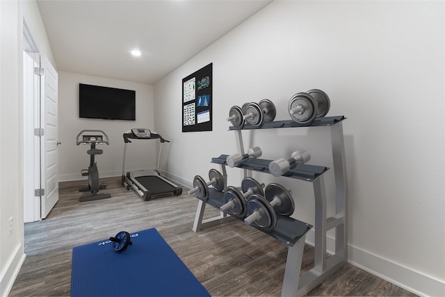 exercise area featuring hardwood / wood-style floors