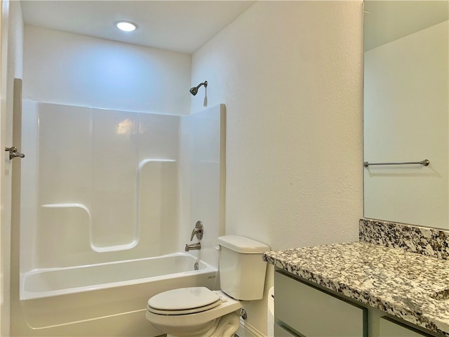 full bathroom with  shower combination, vanity, and toilet