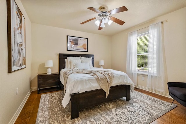 bedroom featuring dark wood-type flooring and ceiling fan