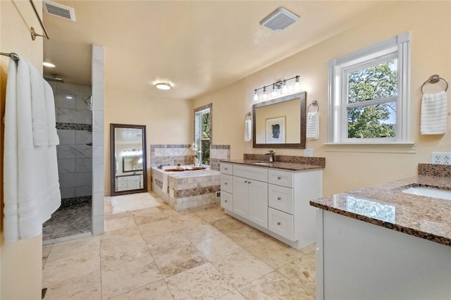 bathroom featuring vanity and plus walk in shower