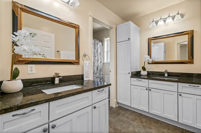 bathroom with vanity and tile patterned floors