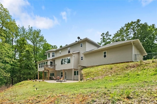 back of house featuring a yard and a patio area