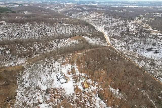 snowy aerial view featuring a mountain view