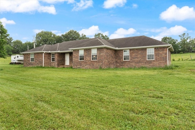 ranch-style house with a front lawn