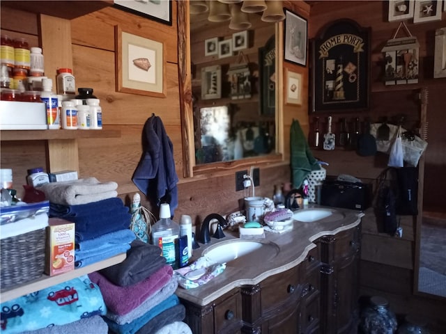 bathroom with wood walls and sink