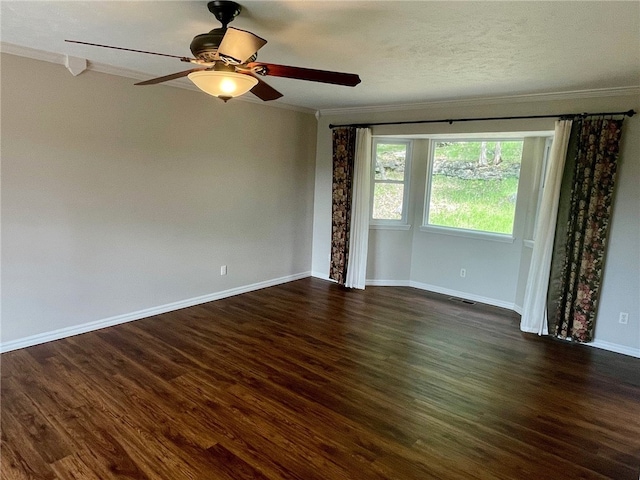 unfurnished room with ceiling fan, crown molding, and dark hardwood / wood-style flooring