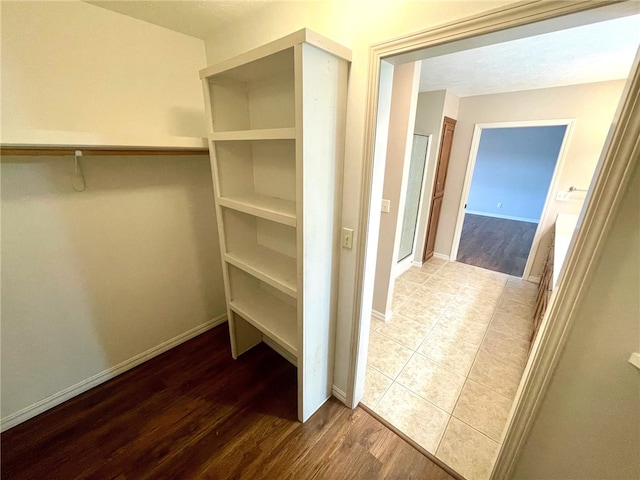 walk in closet featuring hardwood / wood-style floors