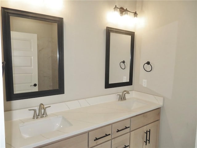 bathroom with double vanity and a sink