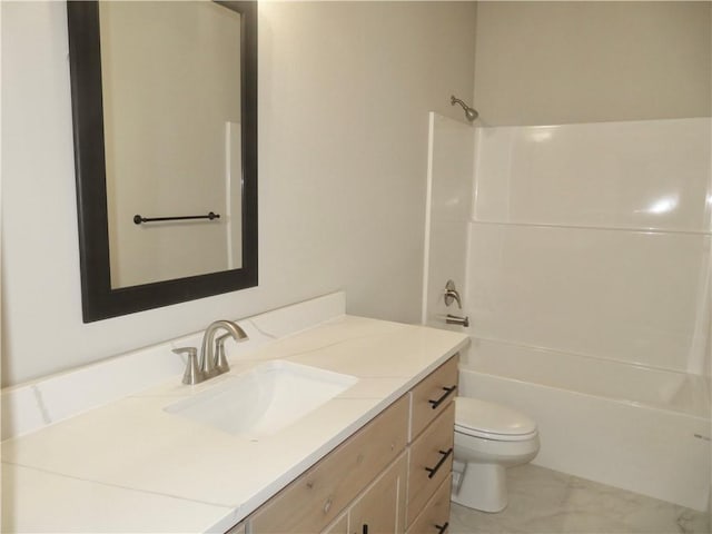 bathroom with toilet, shower / bathing tub combination, and vanity