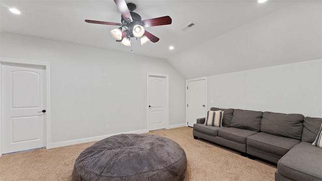 living room featuring lofted ceiling, light colored carpet, and ceiling fan