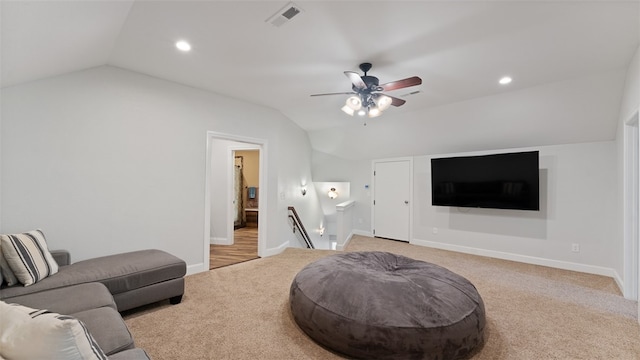 carpeted living room with vaulted ceiling and ceiling fan