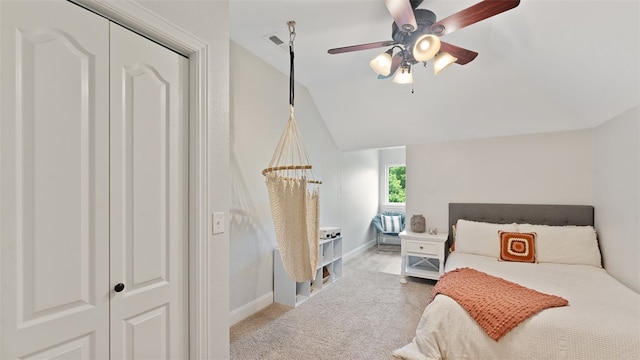 bedroom featuring vaulted ceiling, ceiling fan, and light colored carpet