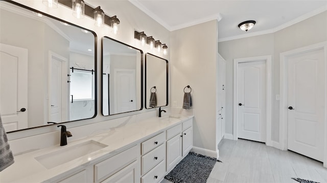 bathroom featuring crown molding, vanity, and walk in shower