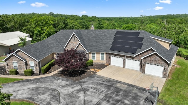 view of front of home featuring solar panels