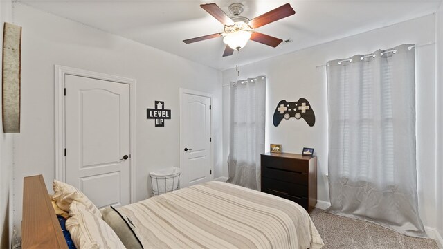 bedroom featuring ceiling fan and carpet flooring