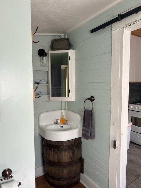 bathroom featuring vanity, toilet, and a textured ceiling