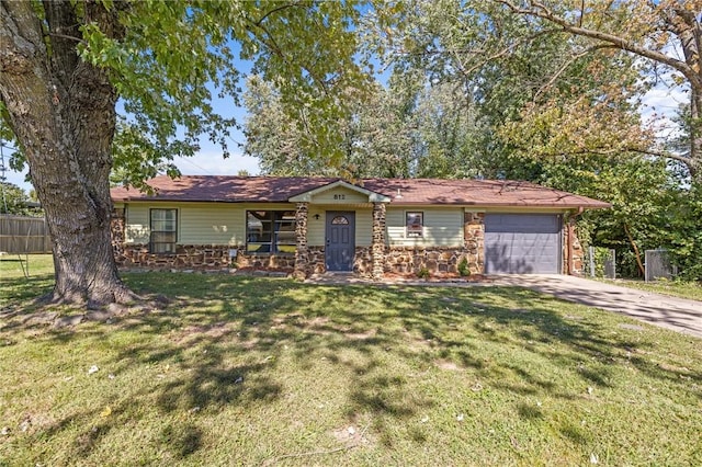 single story home with driveway, a front lawn, an attached garage, and fence