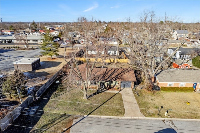 birds eye view of property with a residential view