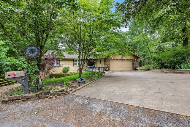 view of front facade with driveway and an attached garage