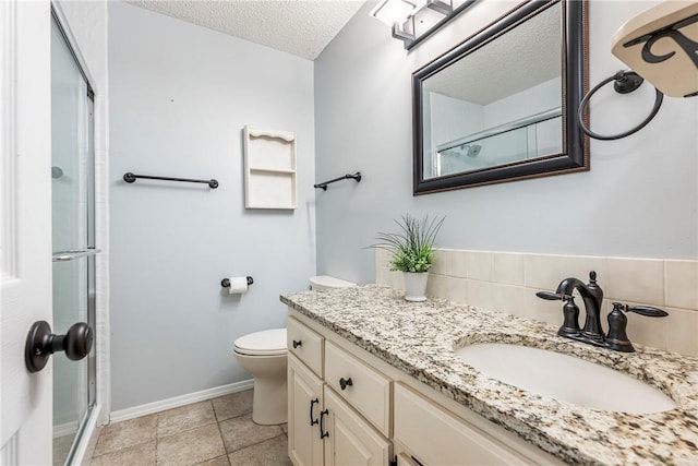 full bath featuring baseboards, toilet, an enclosed shower, a textured ceiling, and vanity