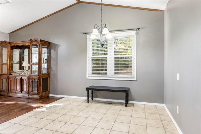 unfurnished dining area featuring baseboards, vaulted ceiling, an inviting chandelier, and light tile patterned floors