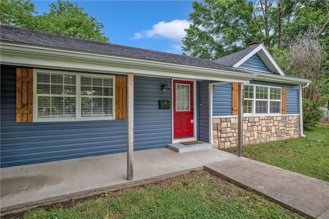 ranch-style house with a front lawn