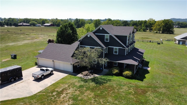 birds eye view of property with a rural view